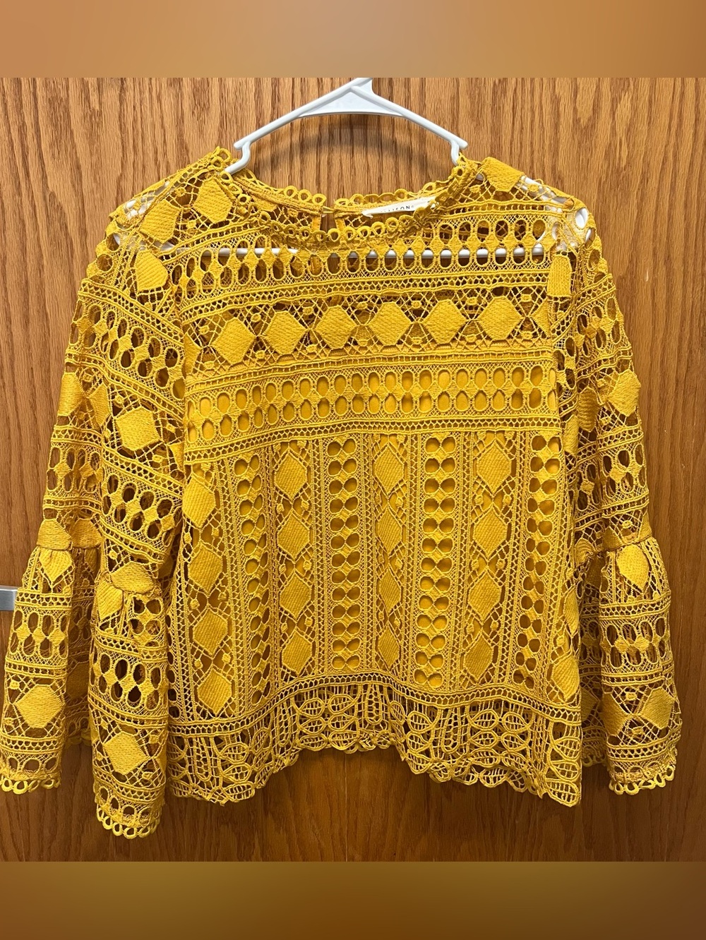 Ellison Crochet Lace Bell-Sleeve Blouse in mustard yellow/marigold. Women’s LG